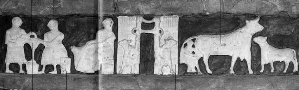 Stone carving at the ancient Sumerian temple of Ninhursag showing typical dairy activities.